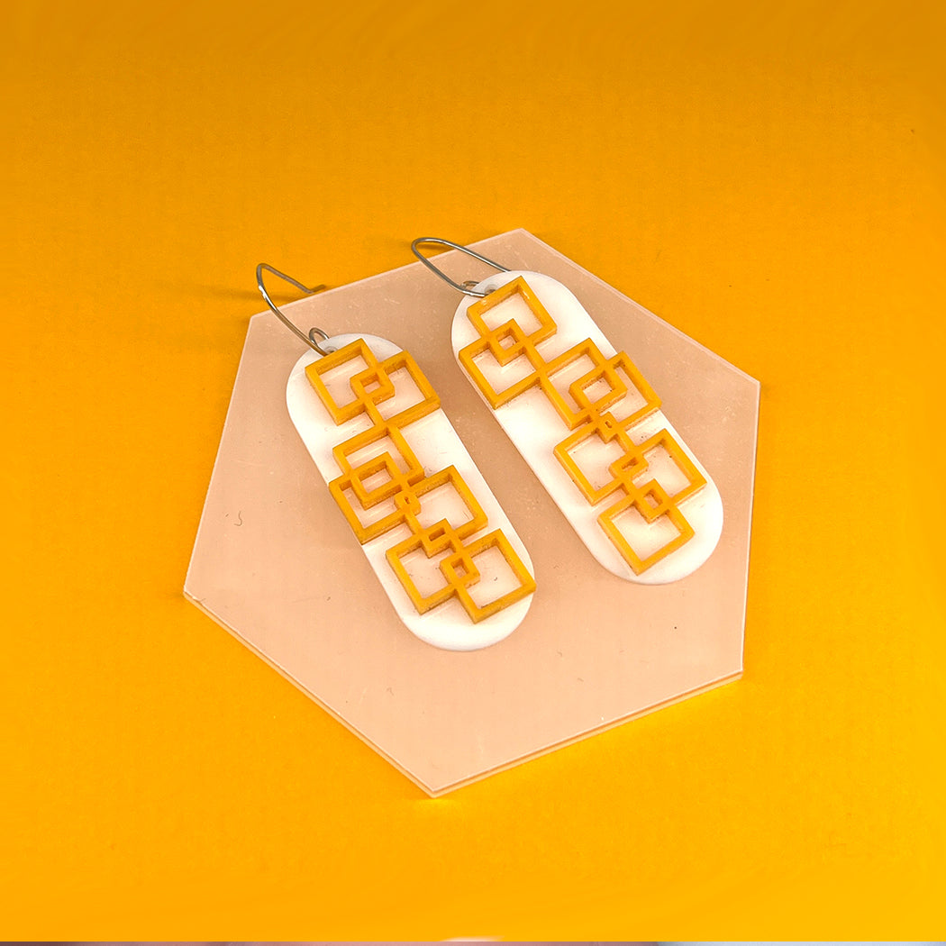 Modernist White and Tangerine square grid earrings from by Barbe Jewelry.