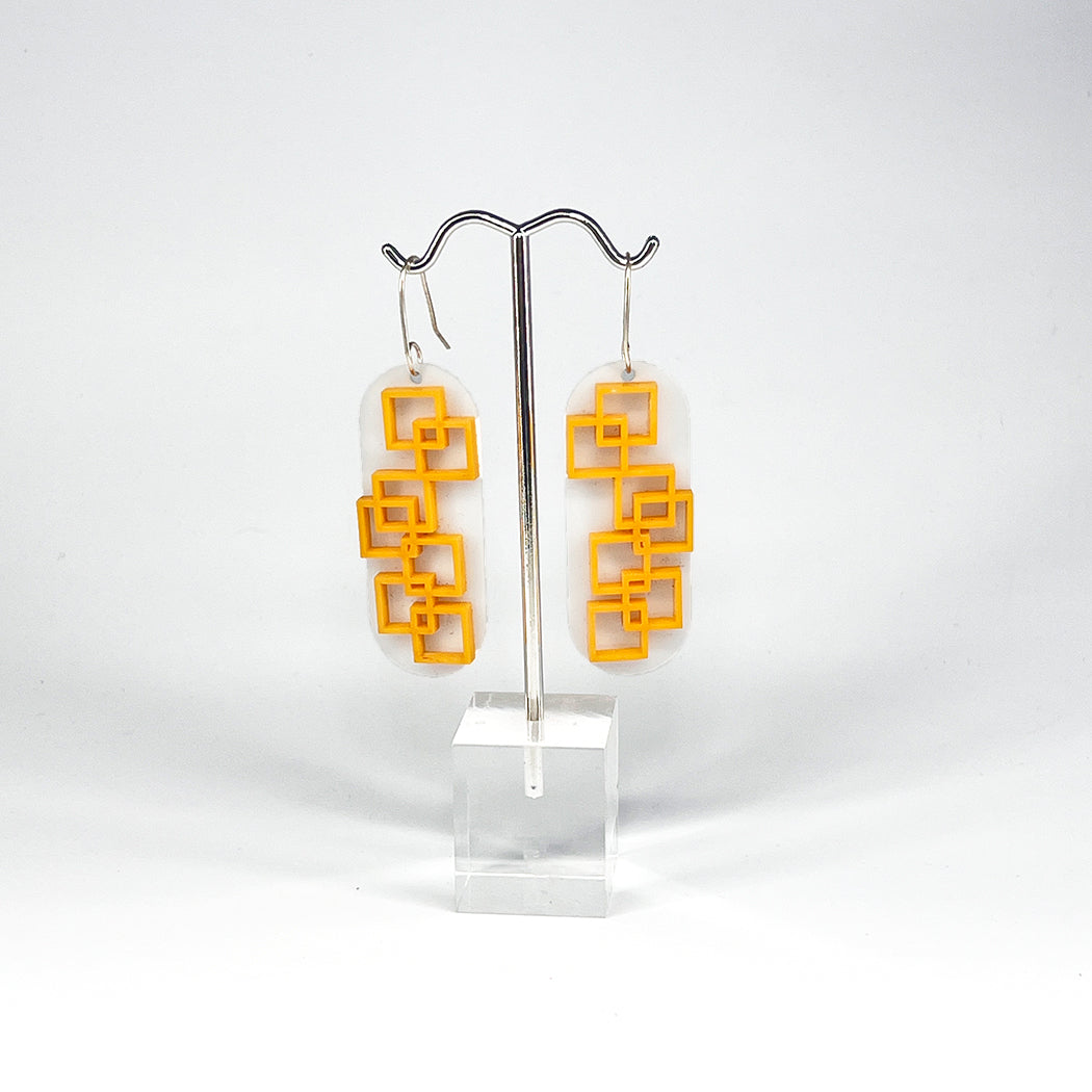 Modernist White and Tangerine square grid earrings from by Barbe Jewelry.