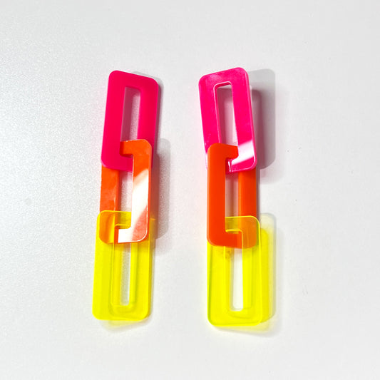 Large acrylic link earrings in neon pink, orange and yellow from Barbe Saint John, Cleveland Ohio