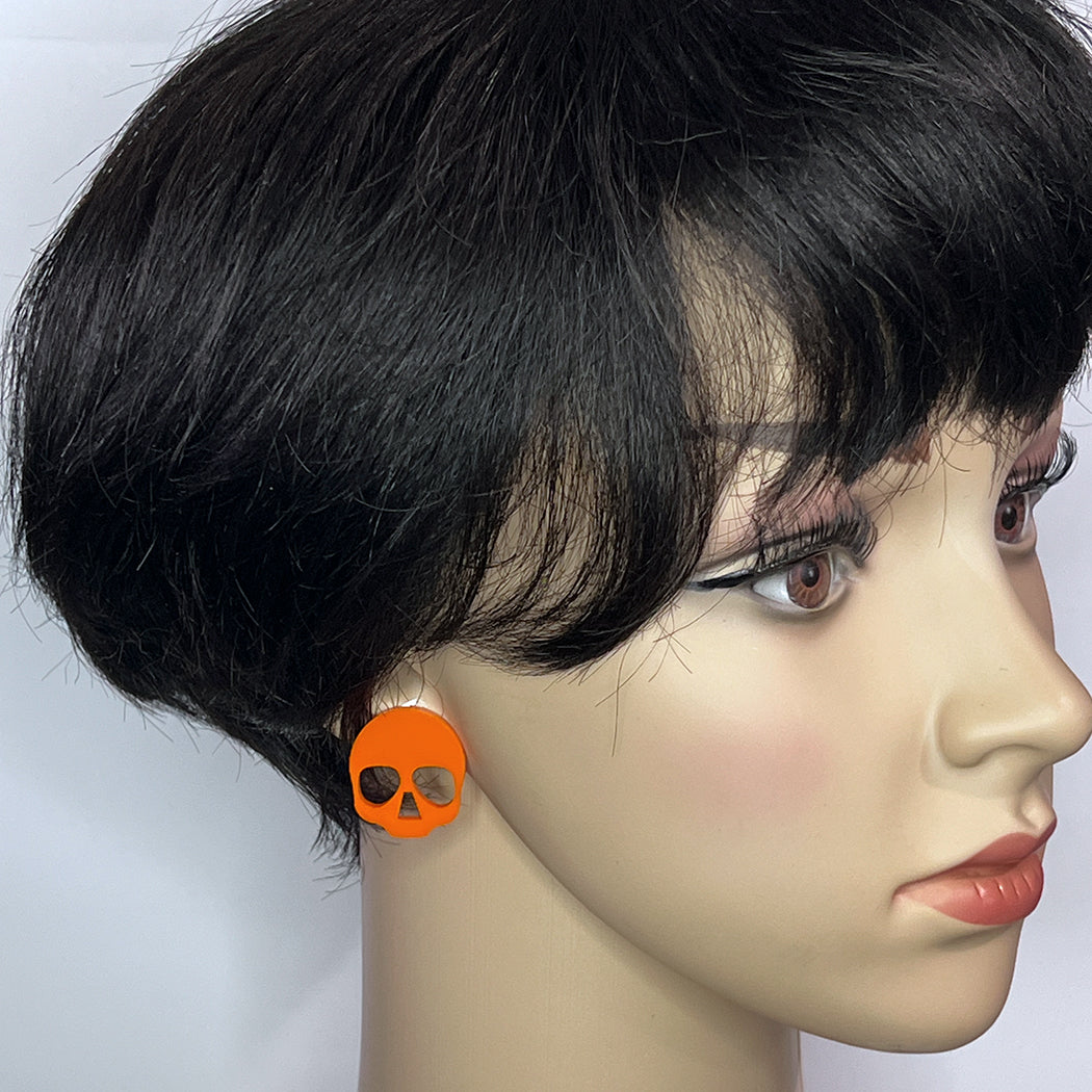 Bright orange acrylic skull post earrings from by Barbe Jewelry. 