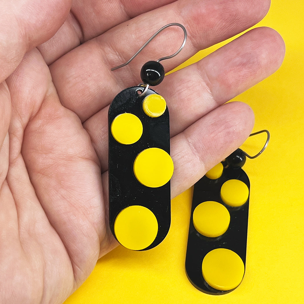 Infinite Dot Love Earrings in black and yellow from by Barbe Jewelry