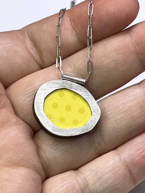 Abstract Oval with Yellow Dots